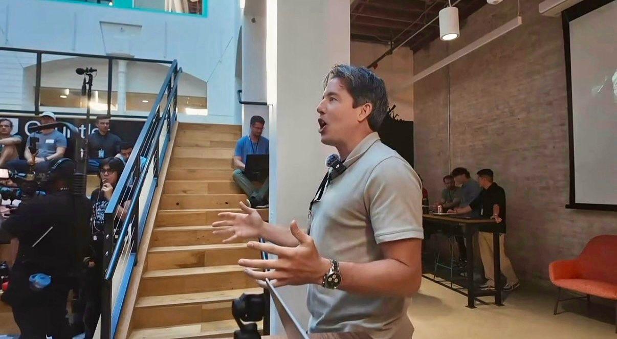 Matt speaking on stage at Gauntlet AI
